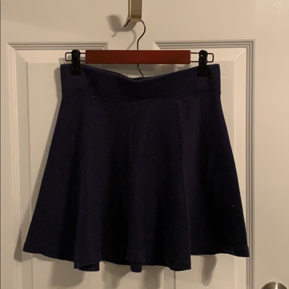 Navy blue, ribbed, circle skirt.